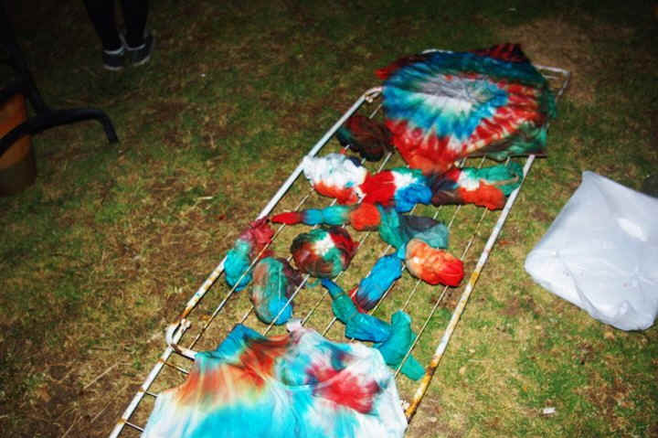 Tie-dye tzitzit drying on a line