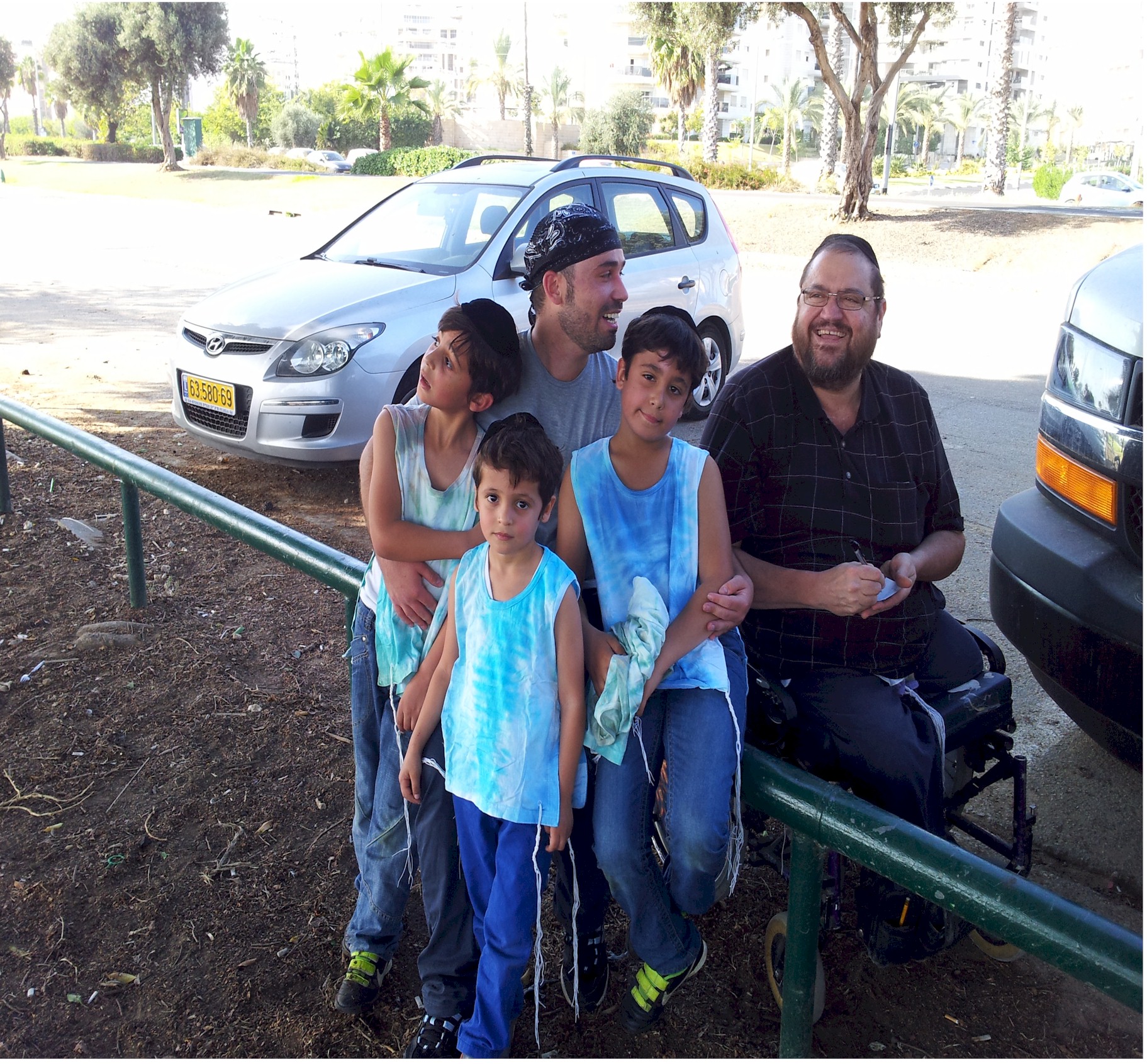 Group of kids in tie-dye tzitzit