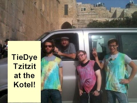Boy in tie-dye tzitzit at the Kotel